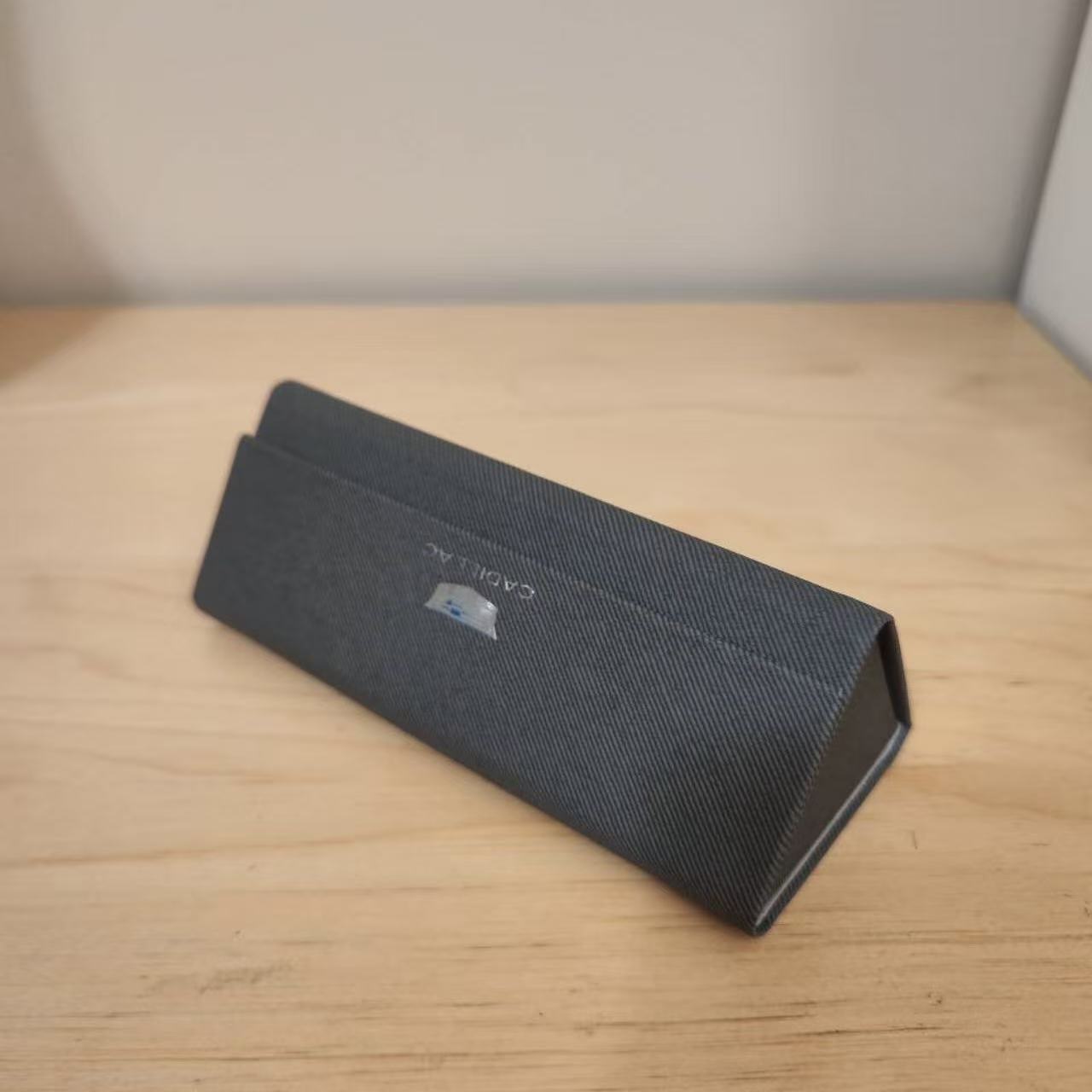 This is a glass case in another perspective,It's the closest thing to a triangle in my house. I chose it because I don't have anything triangular at home.